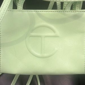 Small light green telfar bag worn once
